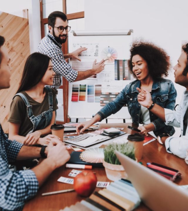 Presentation. Show. White Board. Design Studio. Multi-Ethnic. Project. Creative. Look. People. Designers. Young Specialists. Choose Colors for Design. Teamwork. Discussion. Brainstorming. Workplace.